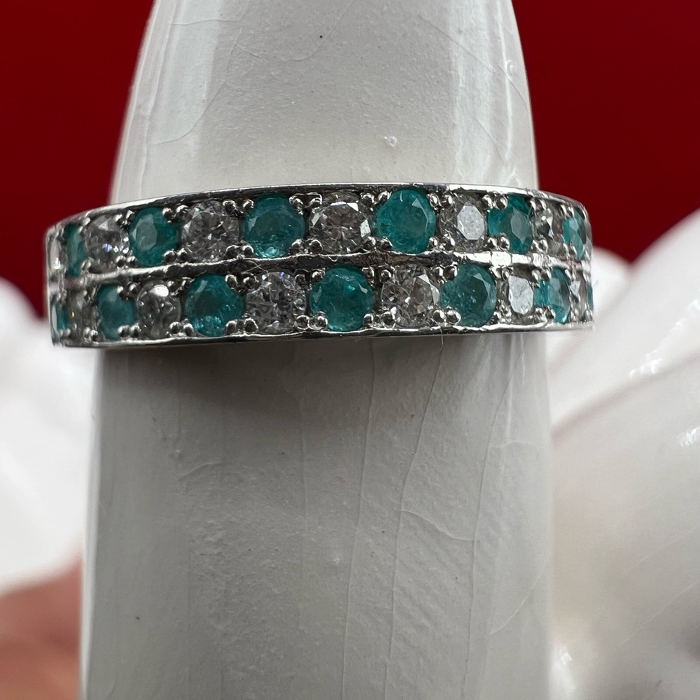 Paraiba half eternity ring in platinum settings